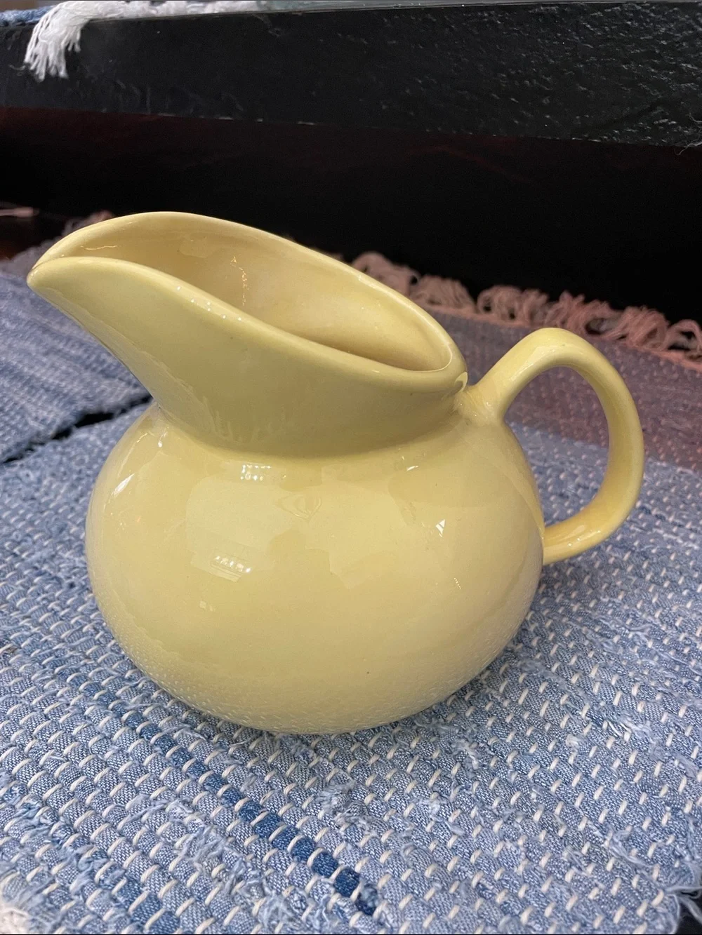 Yellow Ceramic Pitcher. Glossy, Round 5x5. No cracks. One tiny chip on bottom